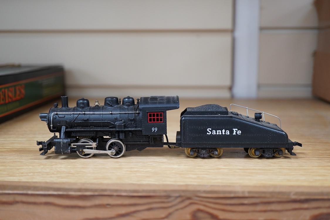 A quantity of US outline HO railway by Athearn, Bachmann, etc. including three locomotives; a Union Pacific Bo-Bo diesel, 1468, a Santa Fe Bo-Bo diesel, 5707, and a Santa Fe 0-4-0 tender engine, together with a 12-wheel